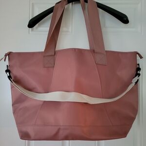 DSW Mauve/Pink Travel Bag/Carry On with Sleeve To Slide On Luggage